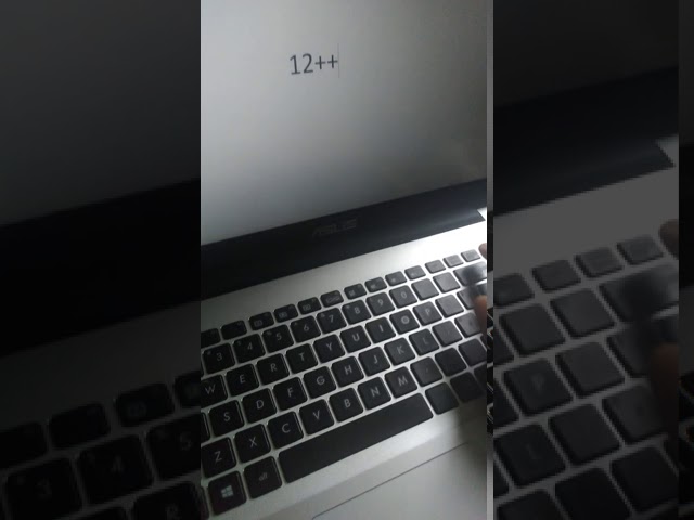 como poner el menos en una laptop